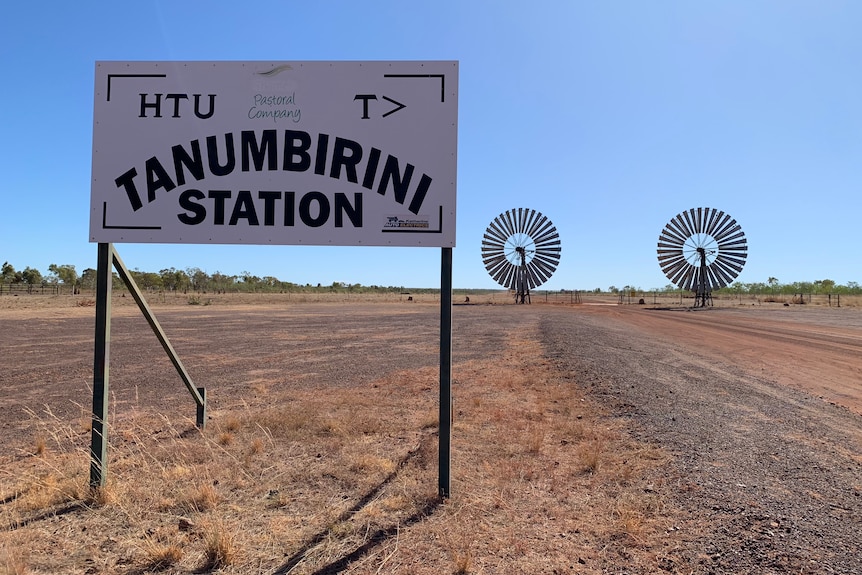 Sign in foreground with two windmills in background