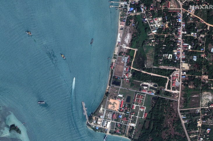 Aerial view of a naval base and dredgers