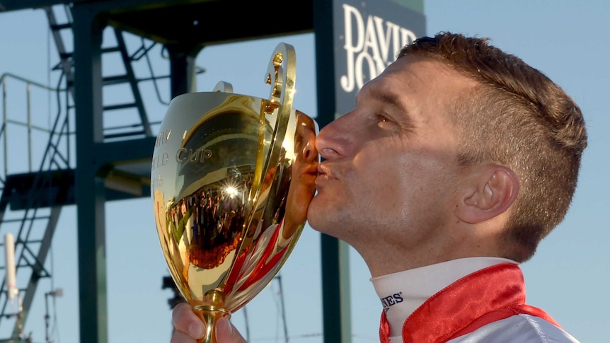 Opie Bosson claims the Caulfield Cup