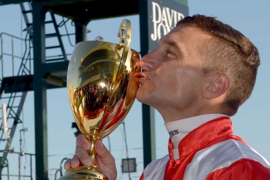 Opie Bosson claims the Caulfield Cup