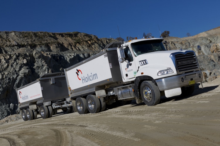 A truck carrying two trailers