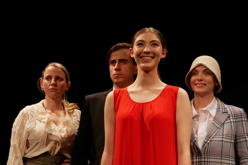 Miss Westralia actors pose for a picture on stage.