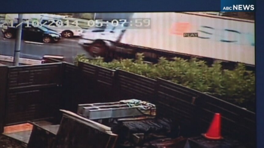 A screen shot of security vision, showing a truck tipping.