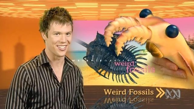 BTN Presenter Nathan Bazeley with graphic background of marine creatures, text reads "Weird Fossils"
