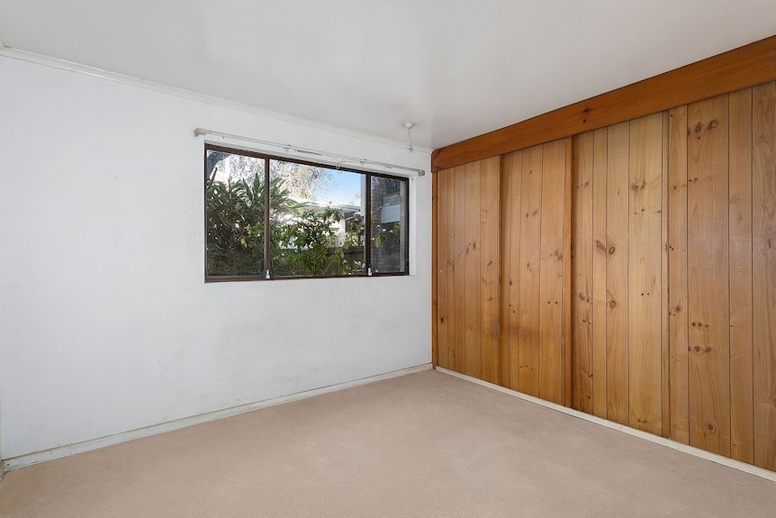 a clean and well lit bedroom