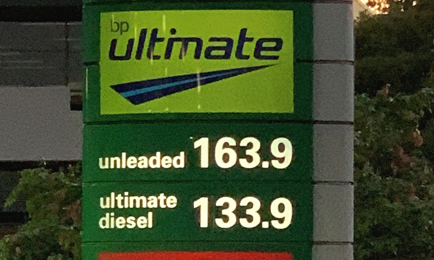 A sign showing the price per litre at a BP petrol station