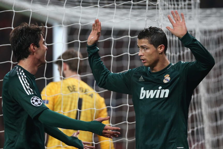 Apologetic winner ... Real Madrid's Cristiano Ronaldo reacts after scoring the winner against his old club.
