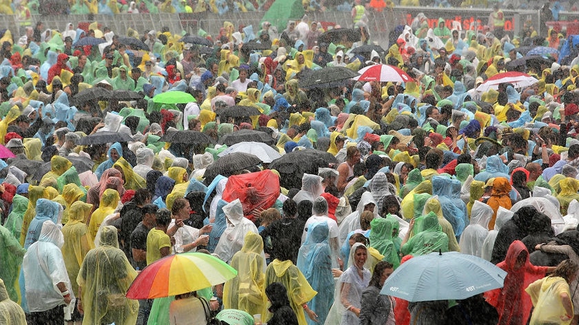 Crowds brave the rain at Melbourne's Sound Relief concert.