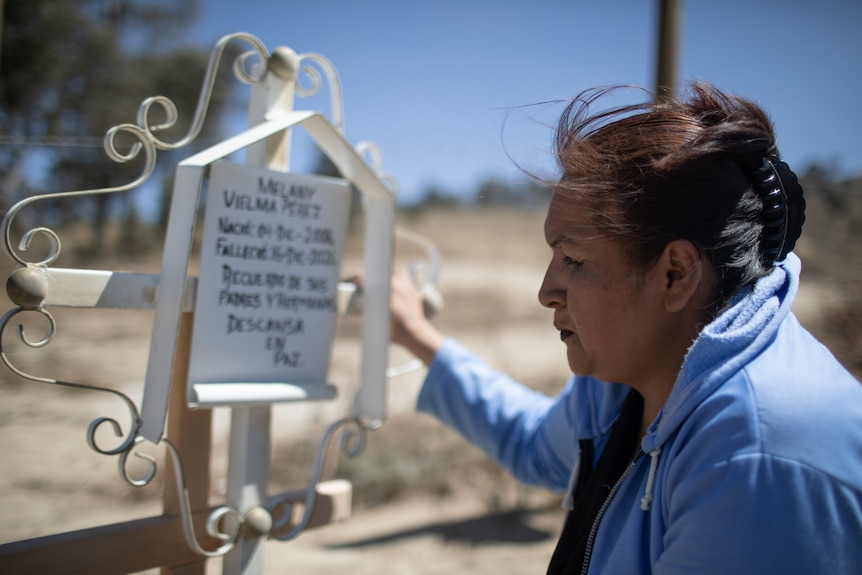 Angeles at her daughter's grave.