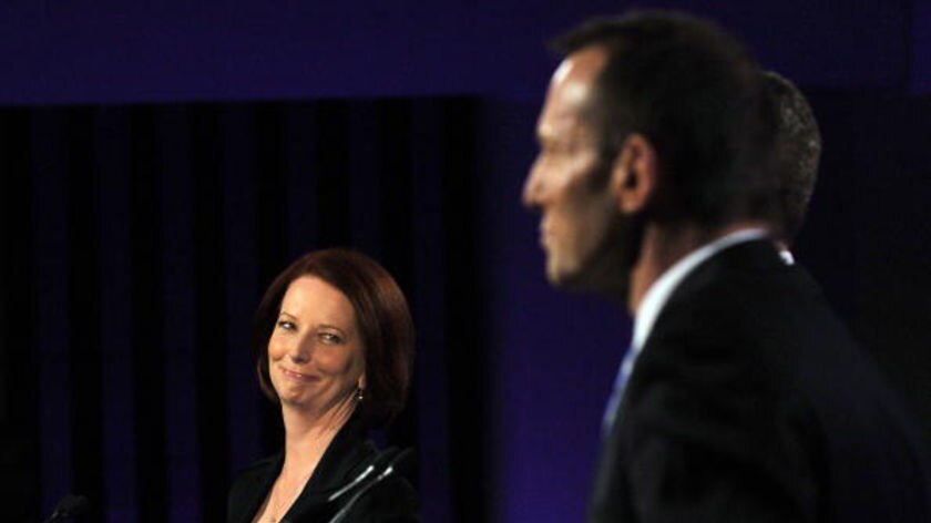 Gillard looks at Abbott during the debate
