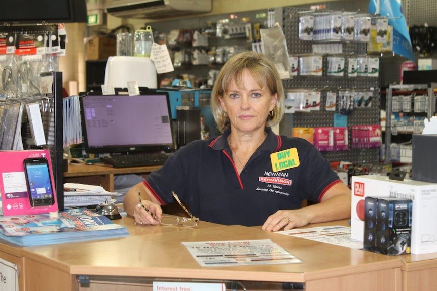 Retailer Debbie Staggard Cooper in her Retravision store