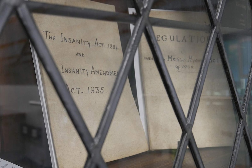 A copy of the former Insanity Act document on a shelf in a glass case at Ipswich, west of Brisbane.