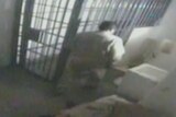 Video still of El Chapo entering prison cell shower