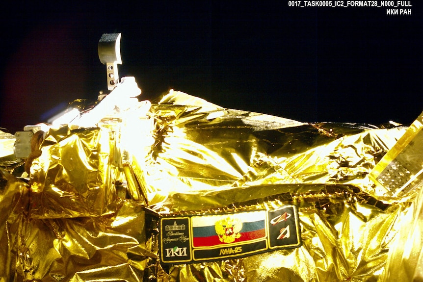 Gold image of a lunar manipulator complex bucket 