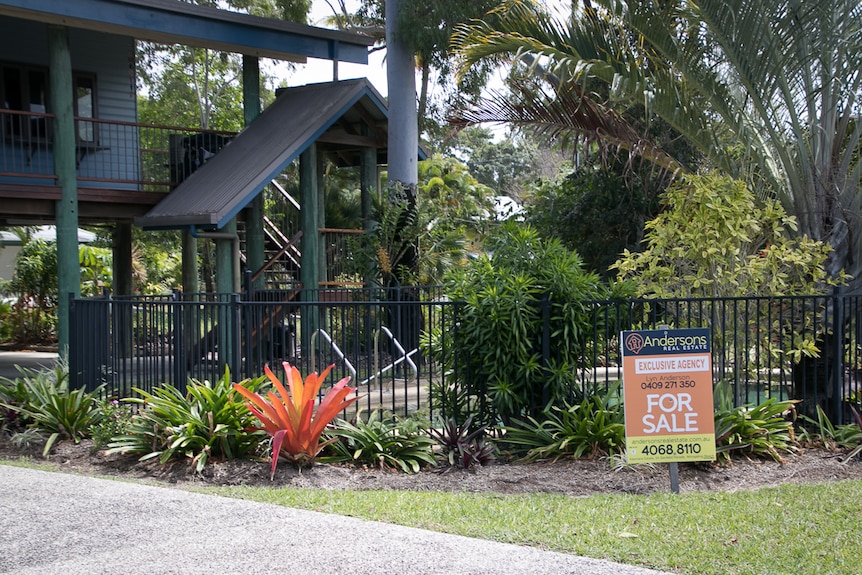 House with for sale sign out front