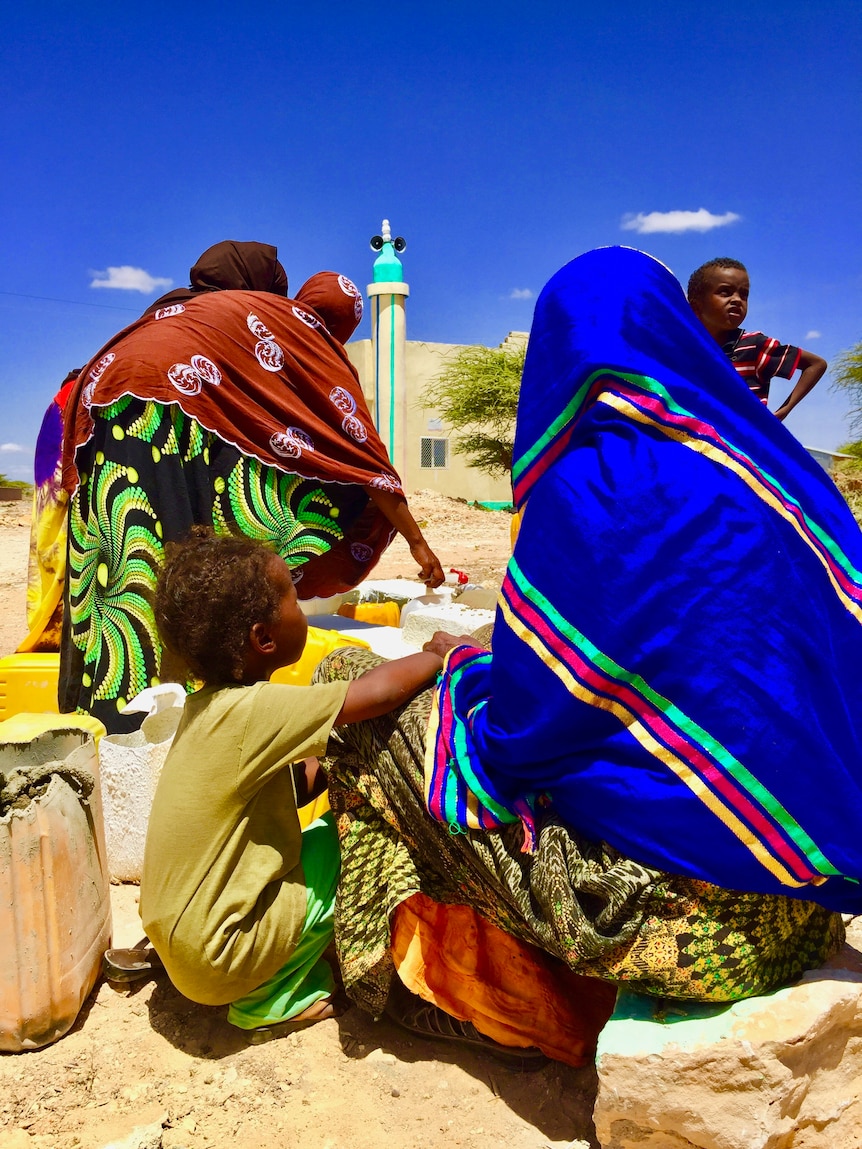 Women collecting water in Wadamagoo