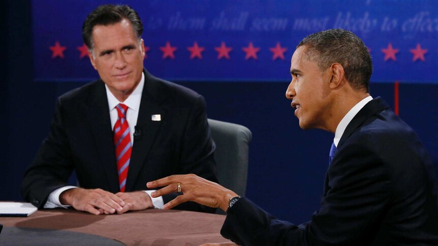 US president Barack Obama (right) makes a point while Republican presidential hopeful Mitt Romney looks on.