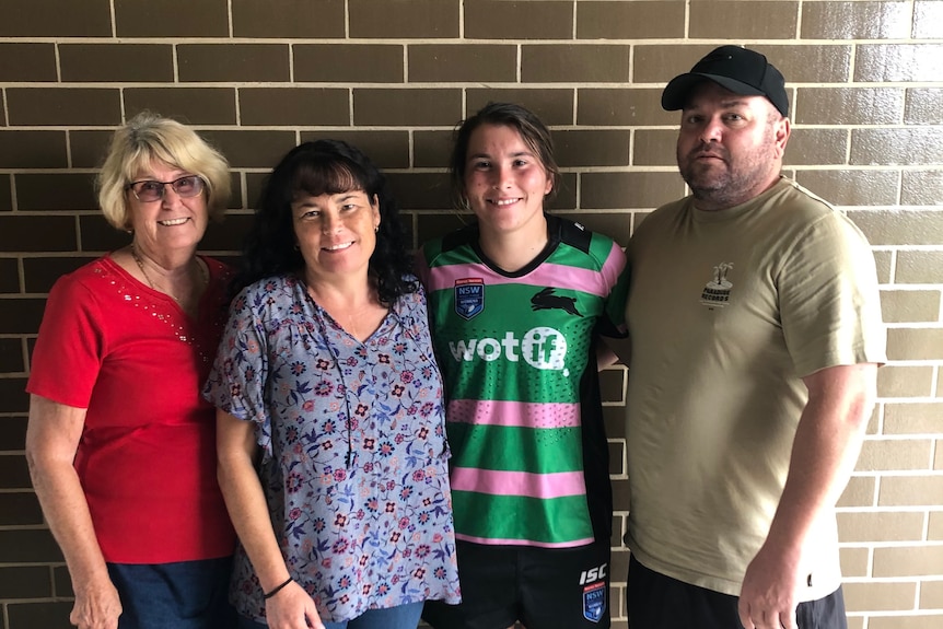 South Sydney Rabbitohs player Sarah Field with her family after her debut