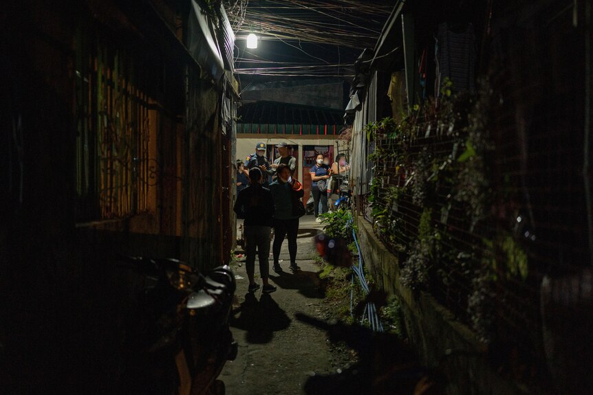Outside a home being raided in the Philippines.