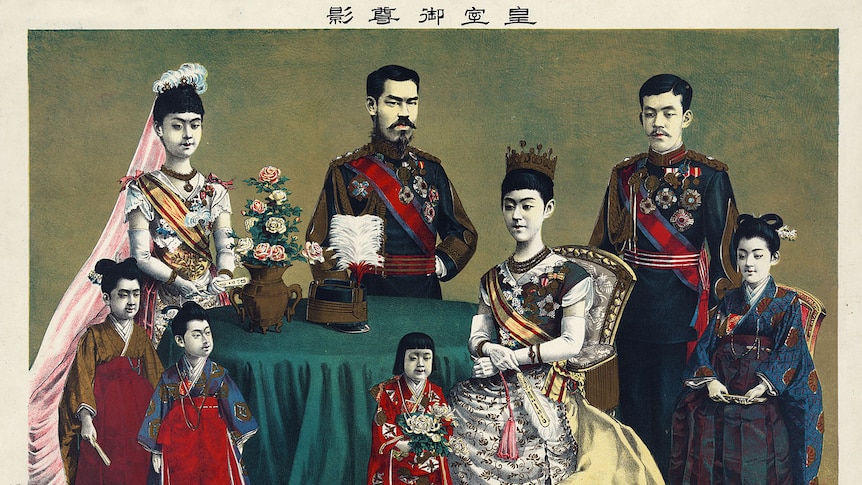 An illustration of the Imperial family of Japan shows men, women and children seated around a green table in imperial regalia.