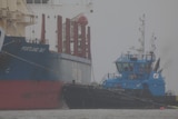 A tug boat and a cargo ship