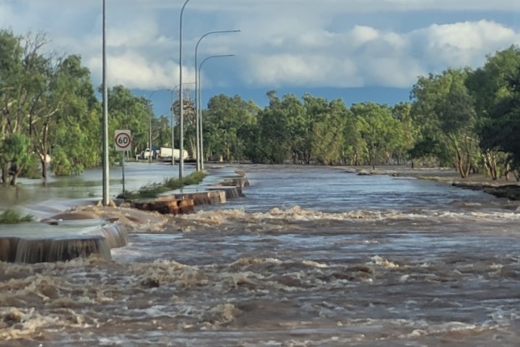 A flooded and broken road in the Kimberley.