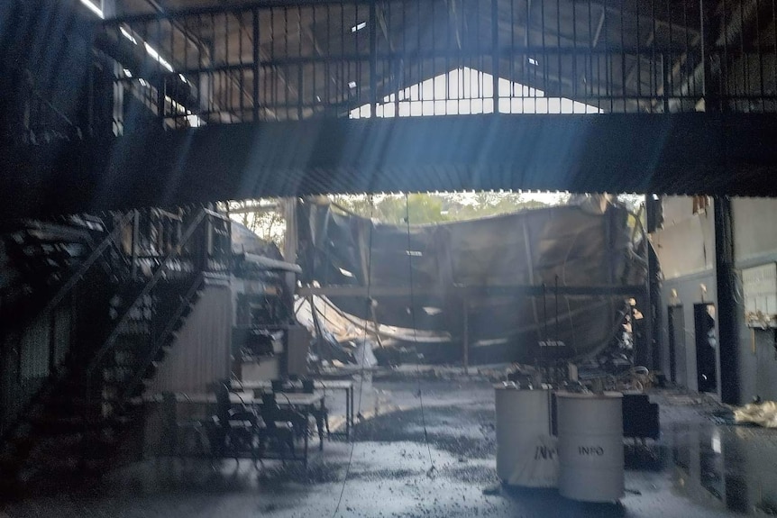 Burned interior of large, open building