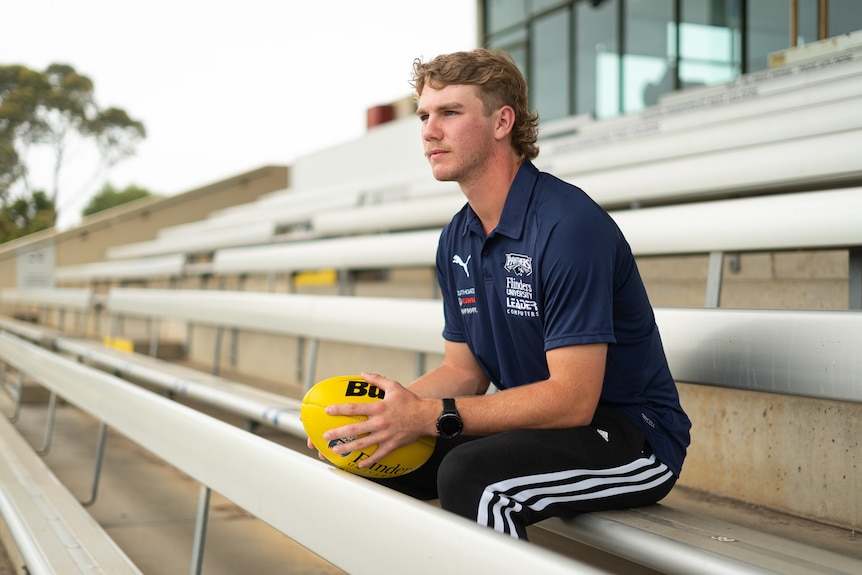 Jason Horne-Francis sitting in an empty grandstand