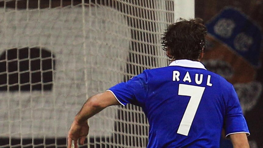 Schalke frontman Raul rounds Inter goalkeeper Julio Cesar to score.
