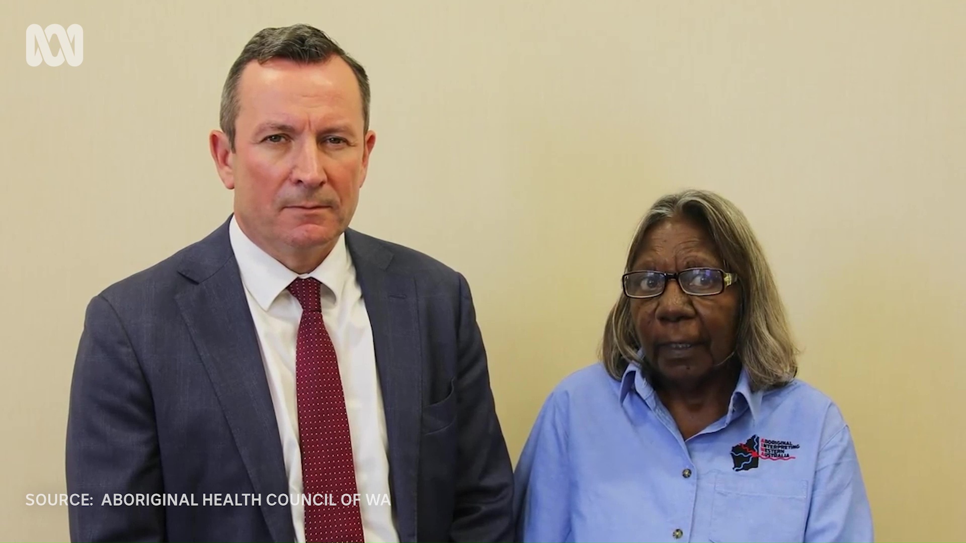 Video still of WA Premier standing alongside a Kriol interpreter