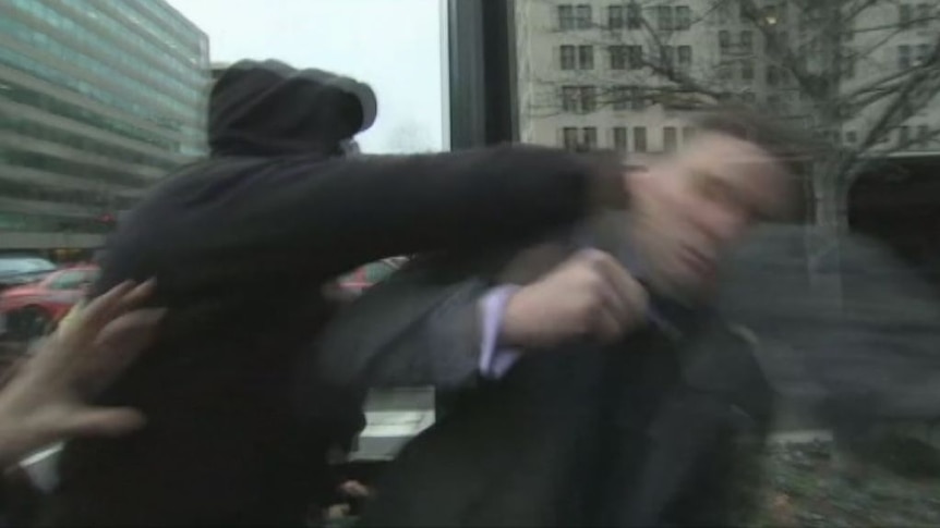 Richard Spencer is punched while being interviewed by Zoe Daniel.