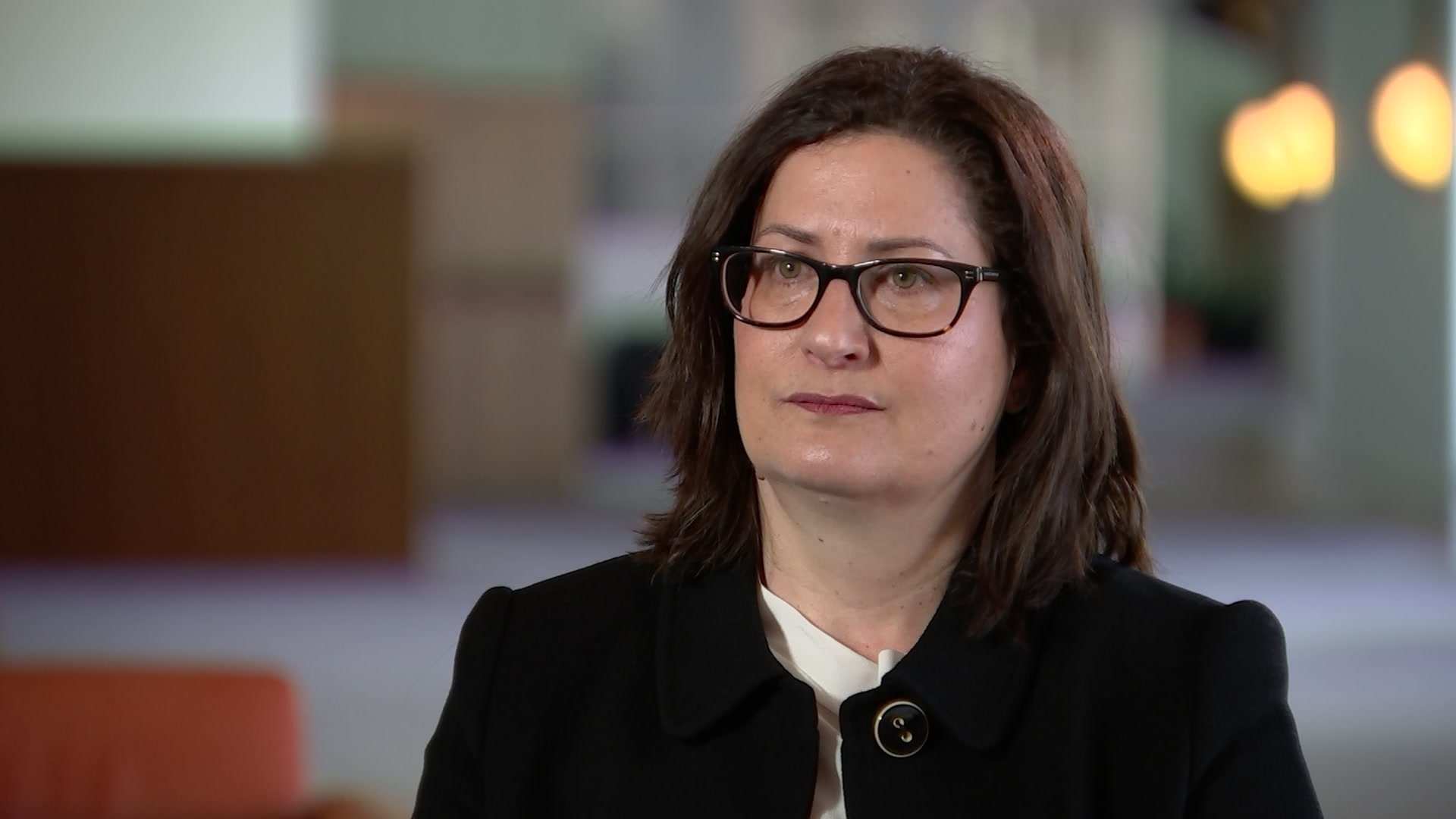 Rachael Falk speaks in an interview.