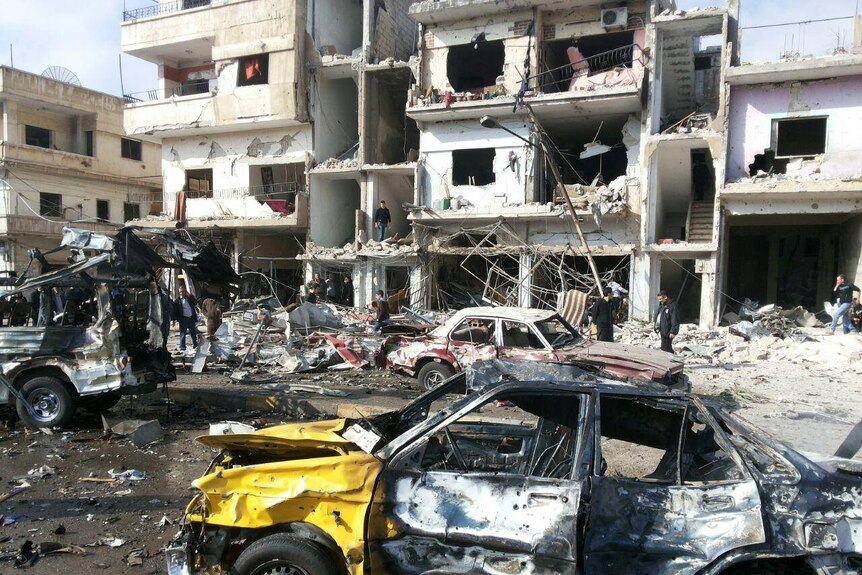 Destroyed cars and building from the twin bomb attack.