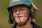 Alyssa Healy walks with her eyes closed and her shoulders slumped
