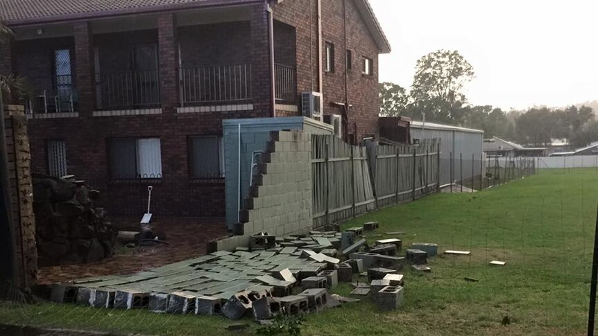 A wall at Goodna knocked down during severe thunderstorms