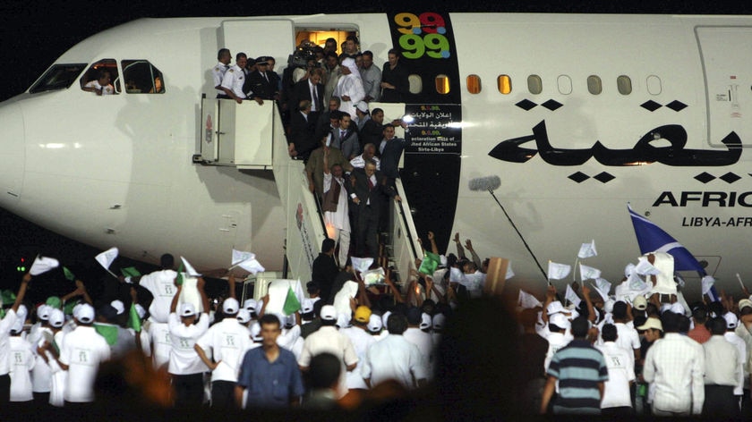 Hero's welcome: Hundreds of young Libyans gathered at an airport in Tripoli to welcome Megrahi home.