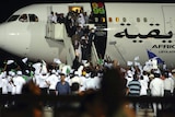 Hero's welcome: Hundreds of young Libyans gathered at an airport in Tripoli to welcome Megrahi home.