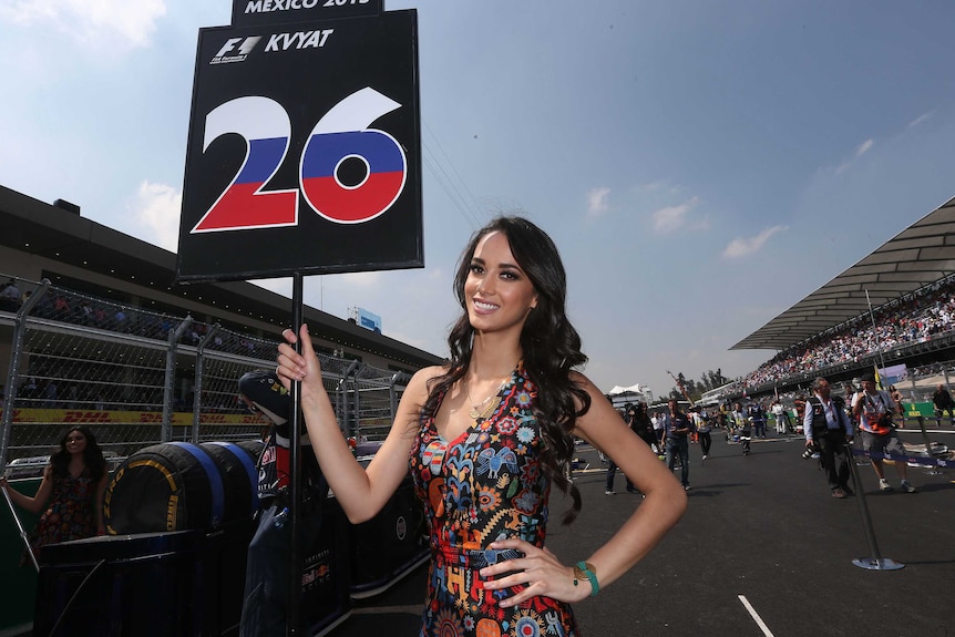 Grid girl holds a sign before the Mexican Grand Prix.