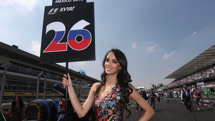 Grid girl holds a sign before the Mexican Grand Prix.