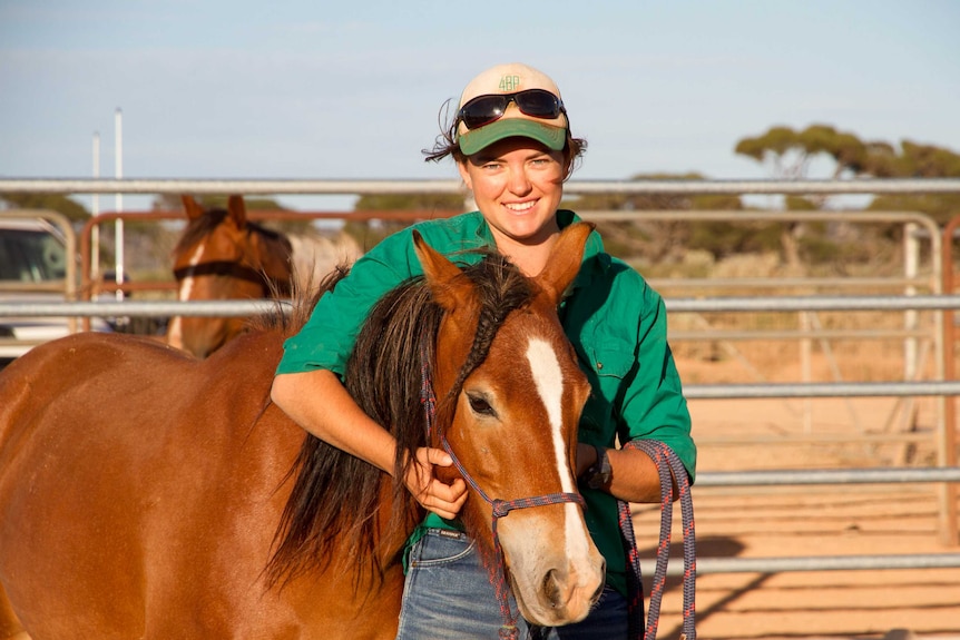 Senior horse trainer at 4PB Meg Rowe with a mare she worked with at Mundrabilla Station.