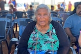 Roebourne resident Pansy Hicks sitting in a chair at the "Old People's Birthday" celebrations