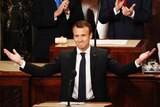 Emmanuel Macron gestures with both hands as he prepares to address US Congress.