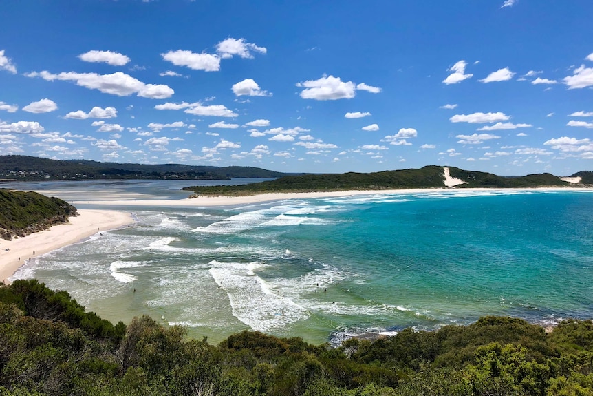 A rugged beach with blue skies