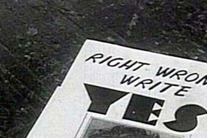 A flyer sits on a table at the 1967 national referendum (ABC TV)