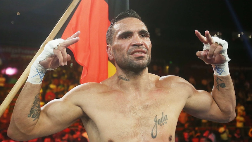 Anthony Mundine celebrates win over Mosley