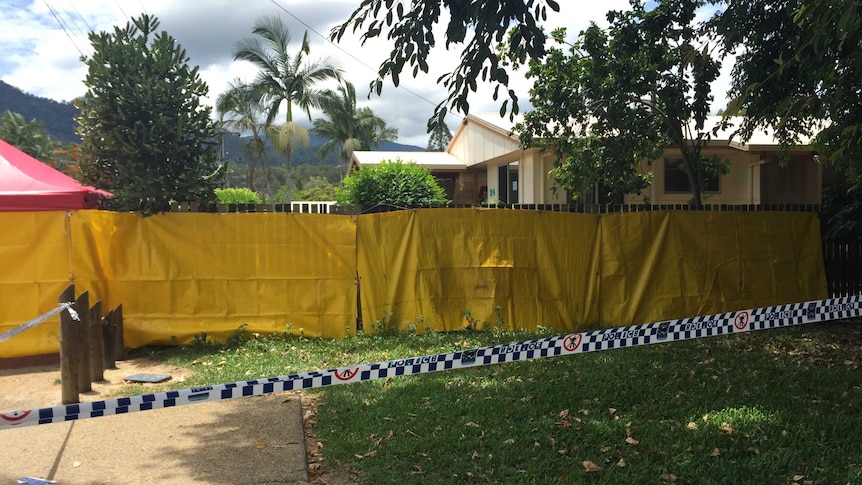 Yellow sheeting surrounds a house in Manoora, Cairns