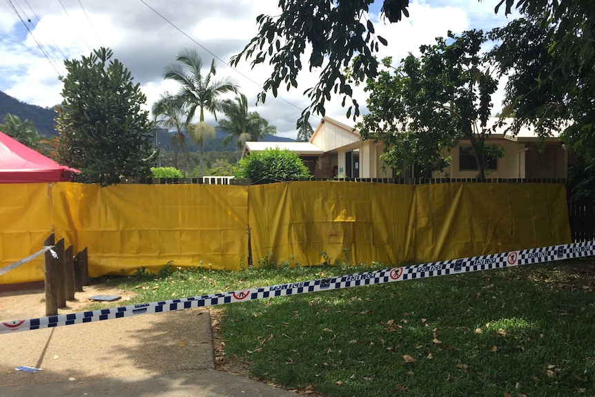 Yellow sheeting surrounds a house in Manoora, Cairns