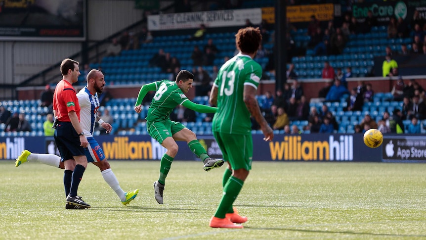 Celtic's Tom Rogic (2R) scores his team's first goal against Kilmarnock in the Scottish Premiership.