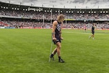 Fremantle's Nat Fyfe leaves the ground on crutches after his team's loss to Carlton