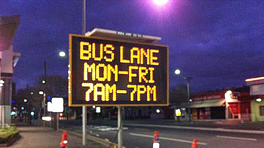 Sign warns of a new buses-only lane